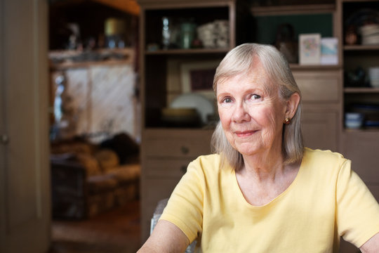 Grinning Woman In Yellow Shirt