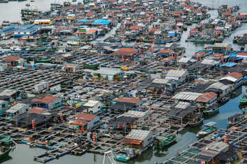 fishing village of poor people on the sea water in island Hainan in China