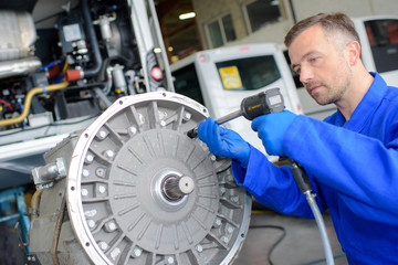 Mechanic using air powered tool