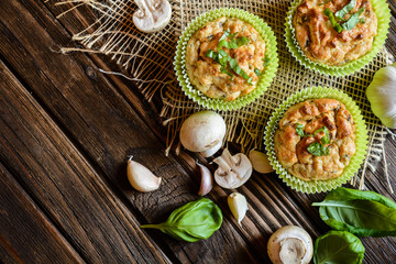Obraz na płótnie Canvas Savory muffins with mushrooms, eggs, green onion and basil