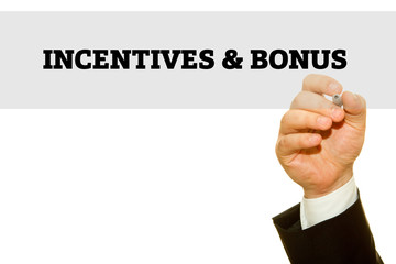 Businessman hand writing Incentives and Bonus on a transparent wipe board.