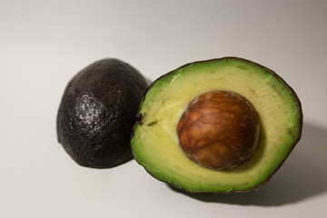 Avocado in half isolated on a white background