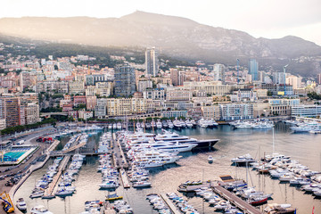 Obraz na płótnie Canvas Cityscape view on the bay with luxury yachts on the french riviera in Monte Carlo in Monaco