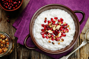 Coconut rice with pomegranate and granola