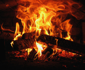 burn firewood into flames in the Russian oven in the village