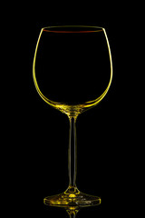 Silhouette of yellow wine glass with clipping path on black background