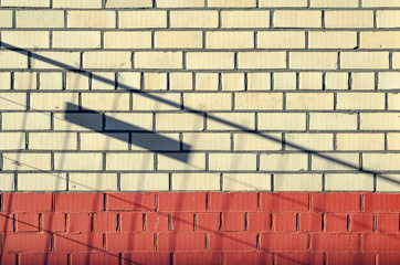 Background with dropping shadow on brick wall. Two-tone brick wall