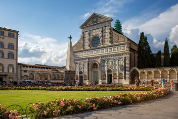 Santa Maria Novella in pink flowers in a summer day. Florence, Italy