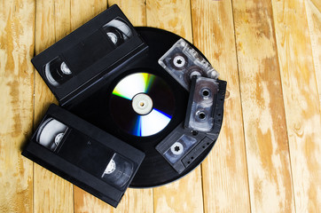 the cartridge for the tape recorder on a wooden table