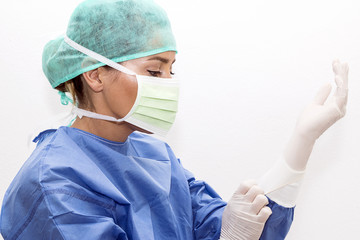 Surgeon using surgical gloves