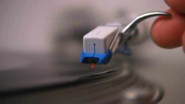 A macro shot of a turntable stylus on a vinyl record. HD 1080.