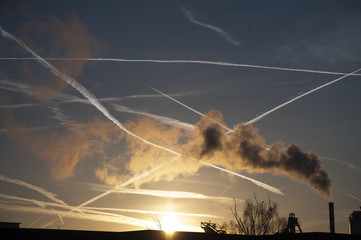 jet trails in the sky at dawn.