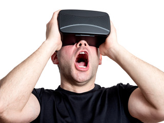 Amazed man using virtual reality glasses isolated on white backg