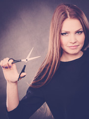 Obraz premium Professional elegant female barber with scissors.