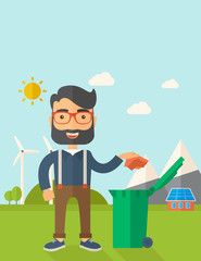 Man throwing paper in a garbage bin