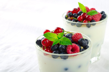 Sweet dessert, pudding, panna cotta with mix berries and mint