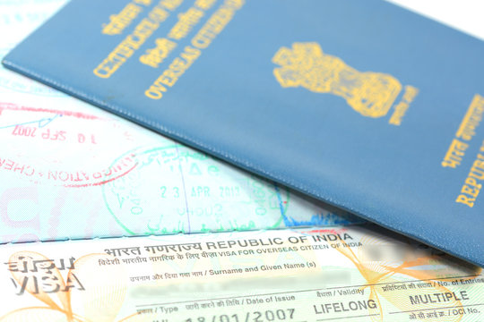 Indian visa stamp on a passport and OCI card. Stock Photo | Adobe Stock