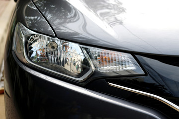 Closeup headlights of car.