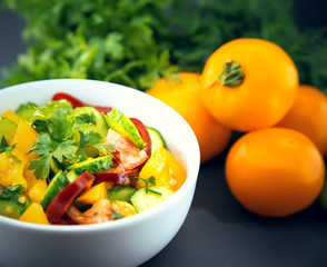 Close Up of colorful salad from tomatoes, cucumbers, peppers and