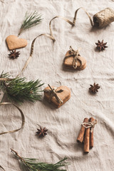 Christmas composition. Workspace. Gift of christmas gingerbread, cinnamon sticks, anise star, pine branch. Flat lay, top view