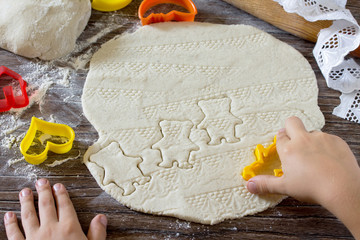Child sculpts Christmas decorations from salt dough. Children's
