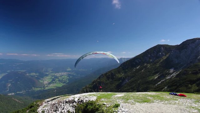Paraglider on the top of mountain above Achensee Lake in Tirol, Austria,
