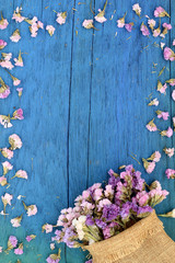 Beautiful flowers on blue wood.