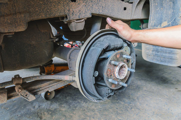 mechanic changing maintenance Disc brake on car