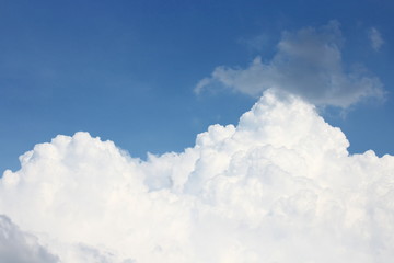 Blue sky with big white clouds, and raincloud  motion on blue sk