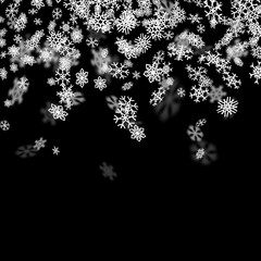 Snowfall background with snowflakes blurred in the dark