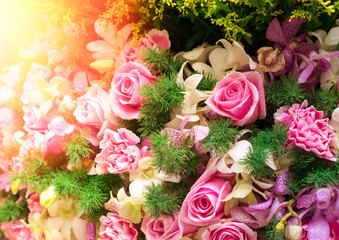 The close up of bouquet of pink Rose, pink Carnation,purple Orch