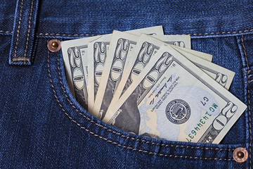 Money in the jeans pocket. Dollars. Twenty-dollar bills