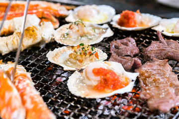 grilling seafood on charcoal grill
