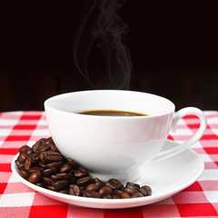 beans & hot coffee in white cup with smoke