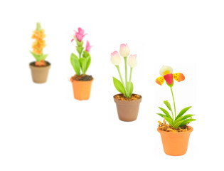Fototapeta na wymiar gradient focus fake flower sets in flowerpot on white background