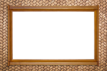 teak picture frame on rattan wall, isolated