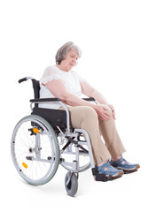 Obraz na płótnie Canvas Senior sitting in wheelchair suffers from knee pain