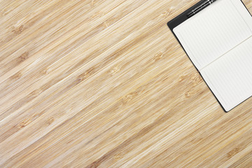 Notebook on the wood table naturally beautiful, diagonal