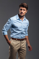 Fototapeta premium Handsome young man standing with hand in pocket