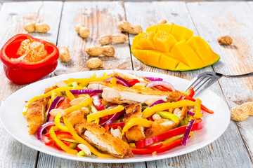 mango, bread crumbed chicken breast,  peanuts, bell pepper salad