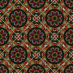 Colorful floral seamless pattern from different rhombus with mandala in patchwork boho chic style, in portuguese and moroccan motif. Hand drawn vector stock illustration