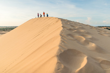 Fototapeta na wymiar White sand dunes in desert on sunrise