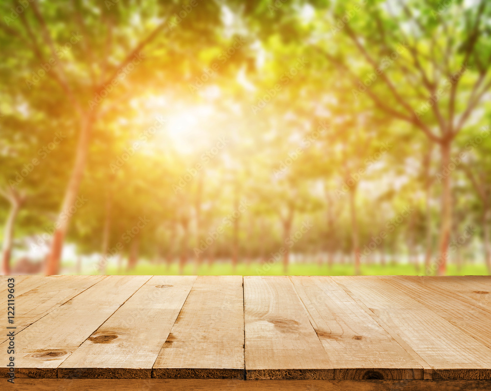 Wall mural wood table top on shiny sunlight bokeh background - can used for