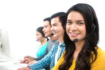 Smiling call center (or telemarketer) team