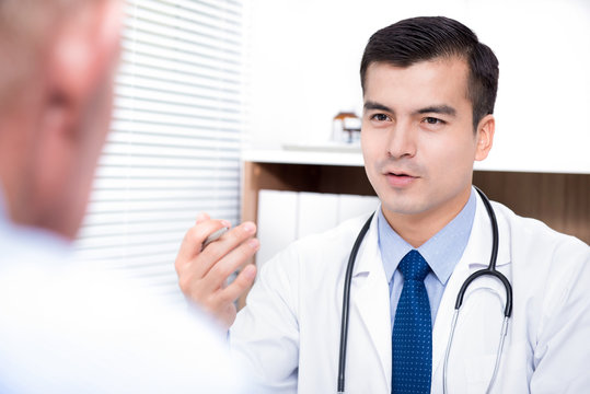 Doctor talking with senior patient