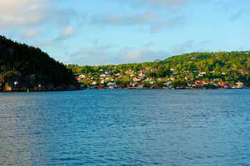 Fototapeta premium The Norwegian town of Sponvika as seen in late afternoon from the Swedish side of the fiord.