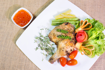 Grilled Chicken steak with sweet sauce, In white dish on the bro