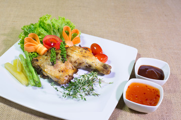 Grilled Chicken steak with sweet sauce sauce, In white dish on t