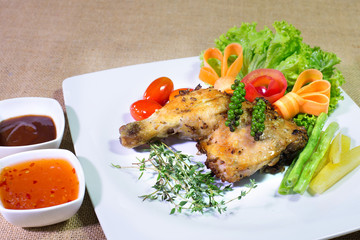 Grilled Chicken steak with sweet sauce sauce, In white dish on t
