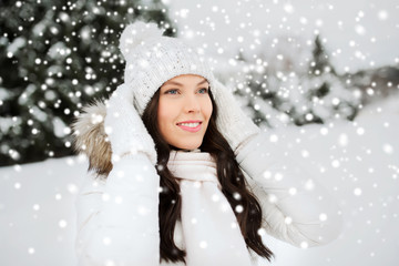 happy woman outdoors in winter clothes